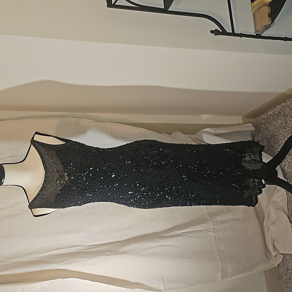 Sleeveless, backless beaded cocktail dress with 1930s vibe